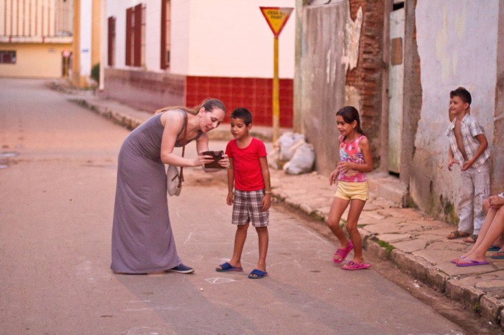 Showing local kids their pictures in Remedios, Cuba